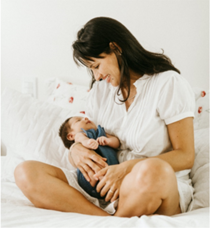 women holding baby