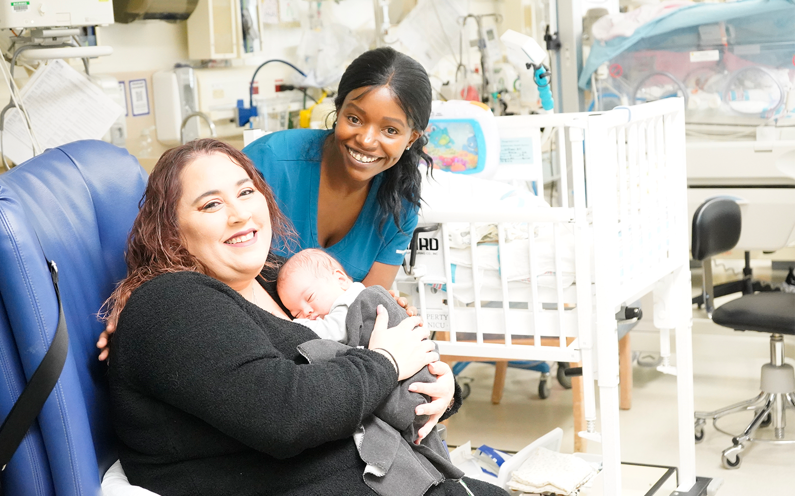 mom holding baby