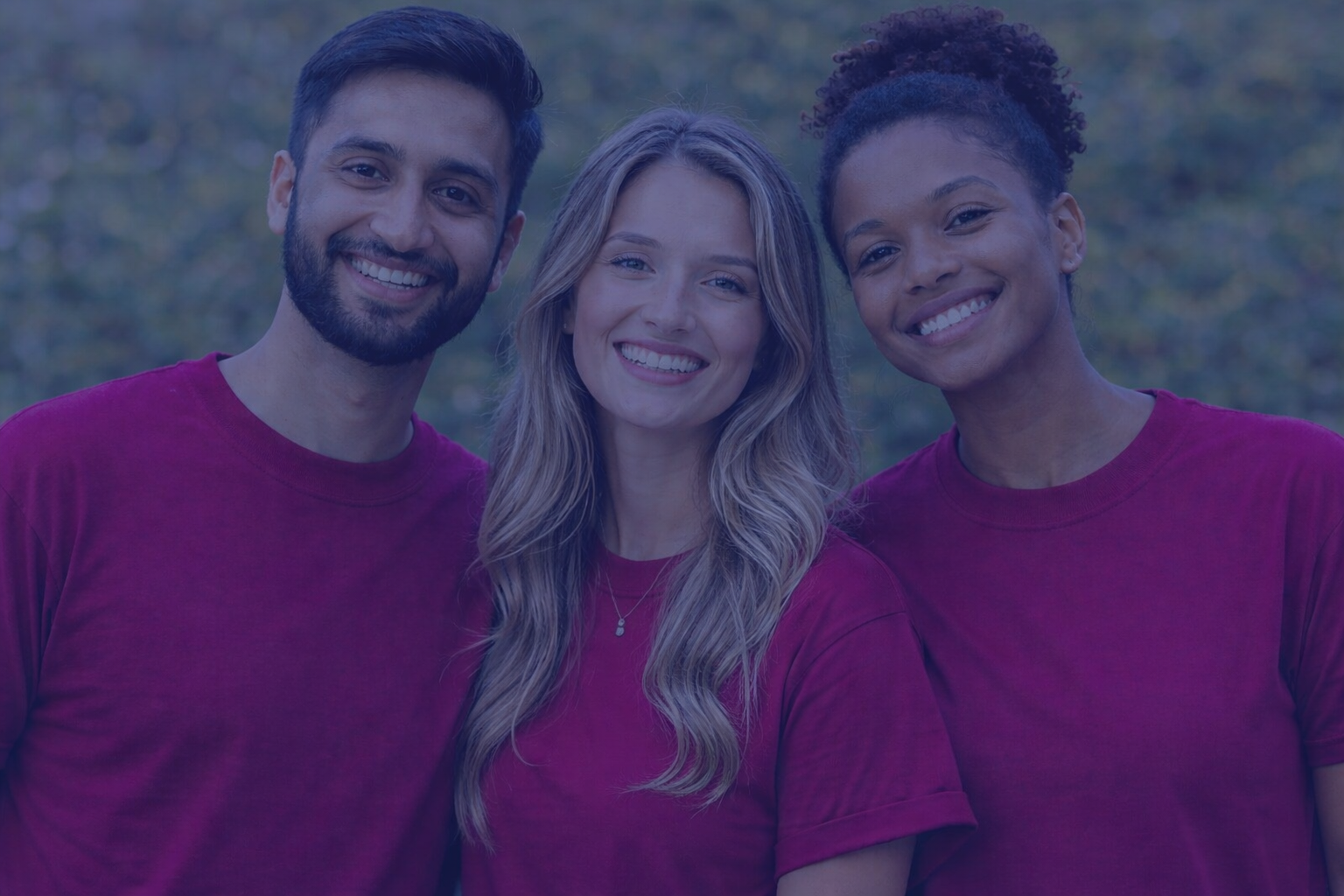 Three people smiling at camera