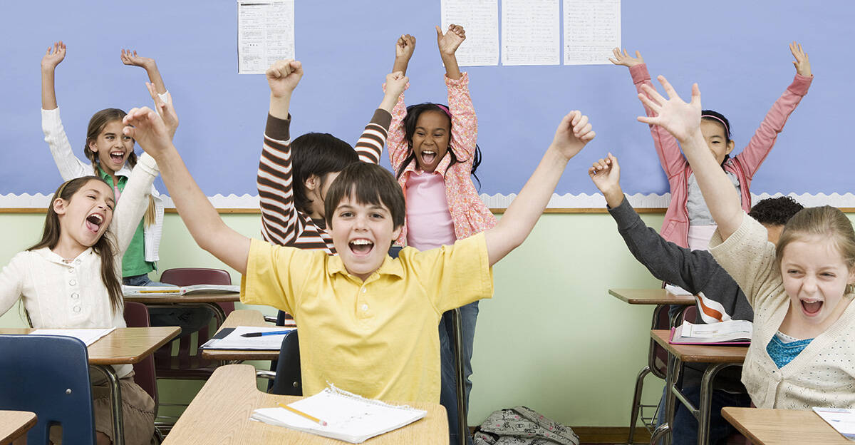 kids in a class room cheering
