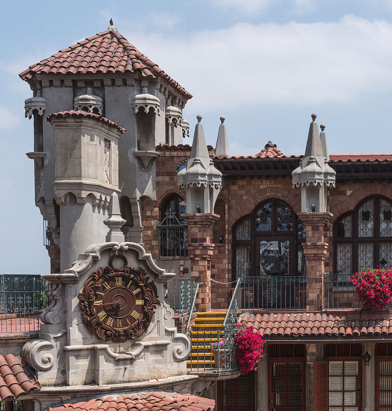 The clock tower and tiled roofs of the Mission Inn
